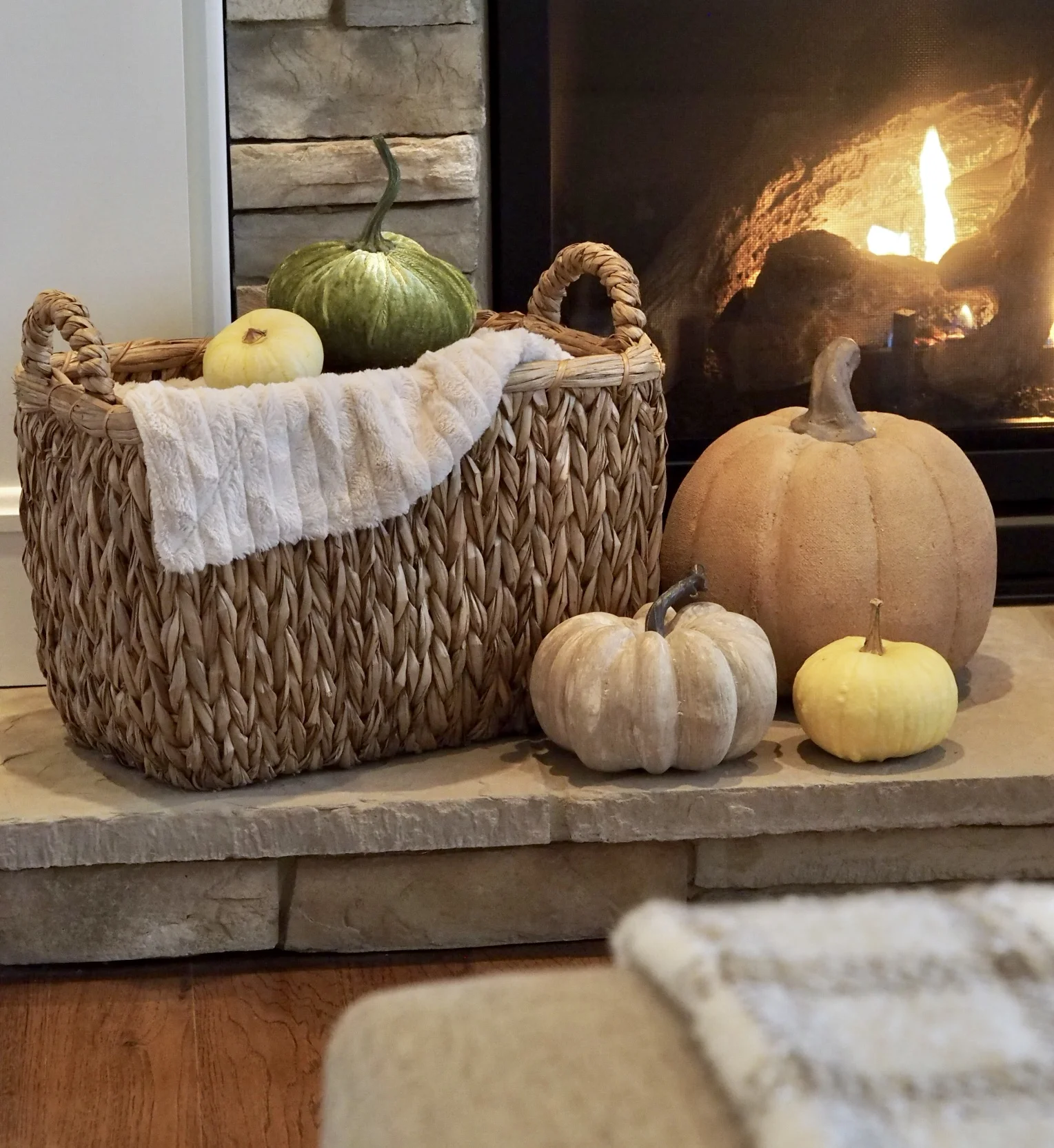 Mixture of faux and real pumpkins. Basket is from Home Goods.