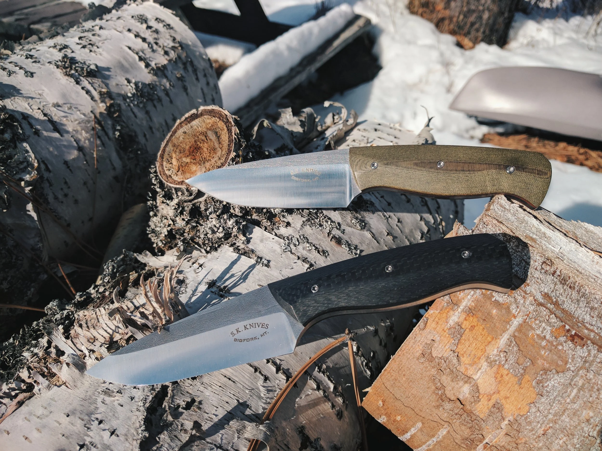 The Ranger, shown in stainless Steel with carbon fiber and G10 handles.
