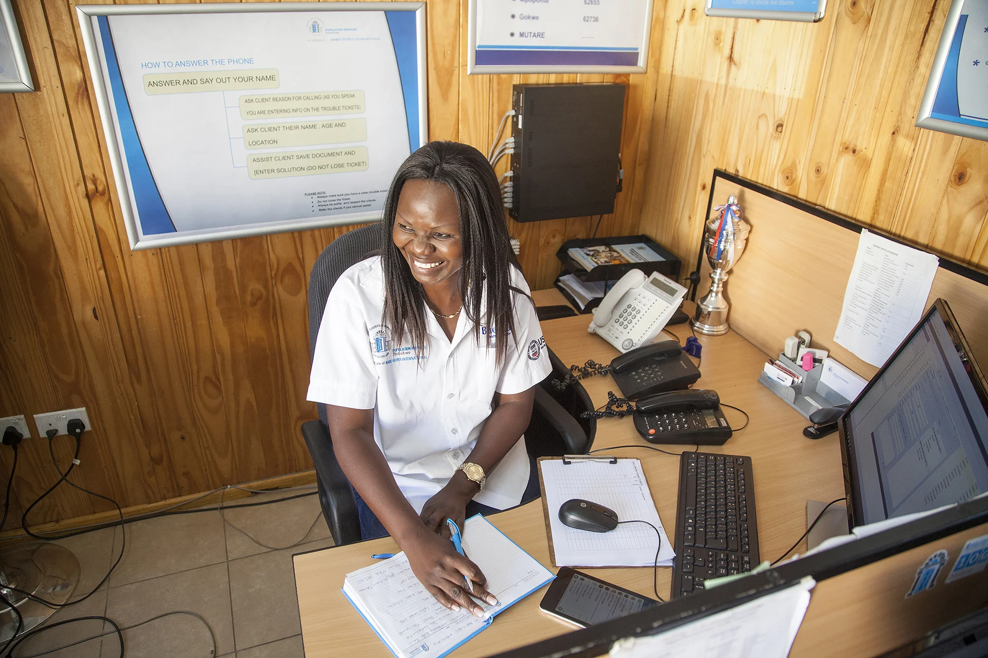 August 21, 2017: Eugenia Five, a call centre coordinator with Population Services Zimbabwe in her office in Belvedere, Harare. - For Marie Stopes International