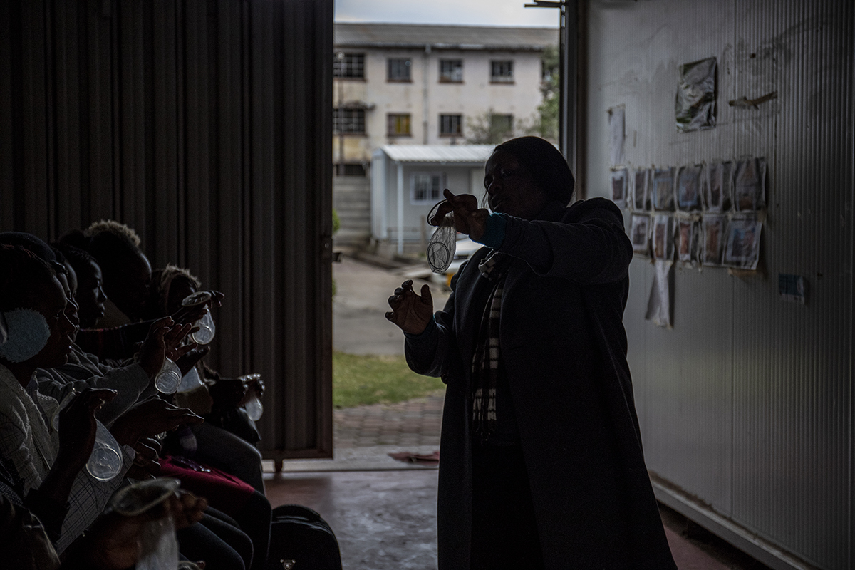 Belinda Chikerema, an intern at the Sisters with a Voice Clinic in Mbare, demonstrates how to use a female condom to clients at the clinic on July 6, 2018. The clinic provides primary health care, contraception, management of sexually transmitted infections (STIs), and HIV testing and referral for antiretrovial therapy (ART) to sex workers in Harare. - Gates Foundation