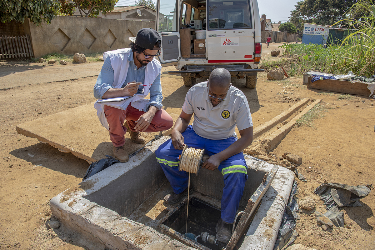 Back view of the data logging probe being lowered into the borehole. - For Médecins Sans Frontières