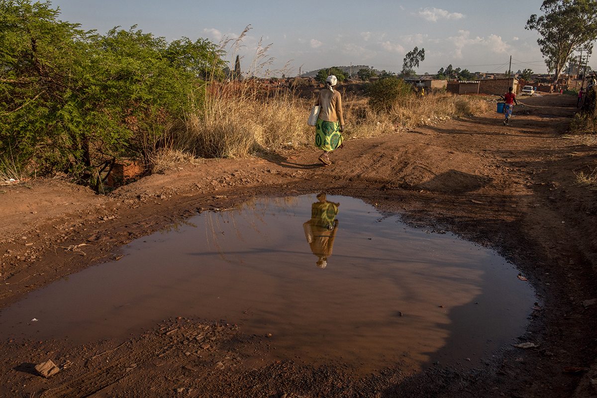 October 20, 2018: Rekina walks home from work. Every day she treks the 8.3-kilometre roundtrip. - For HIVOS