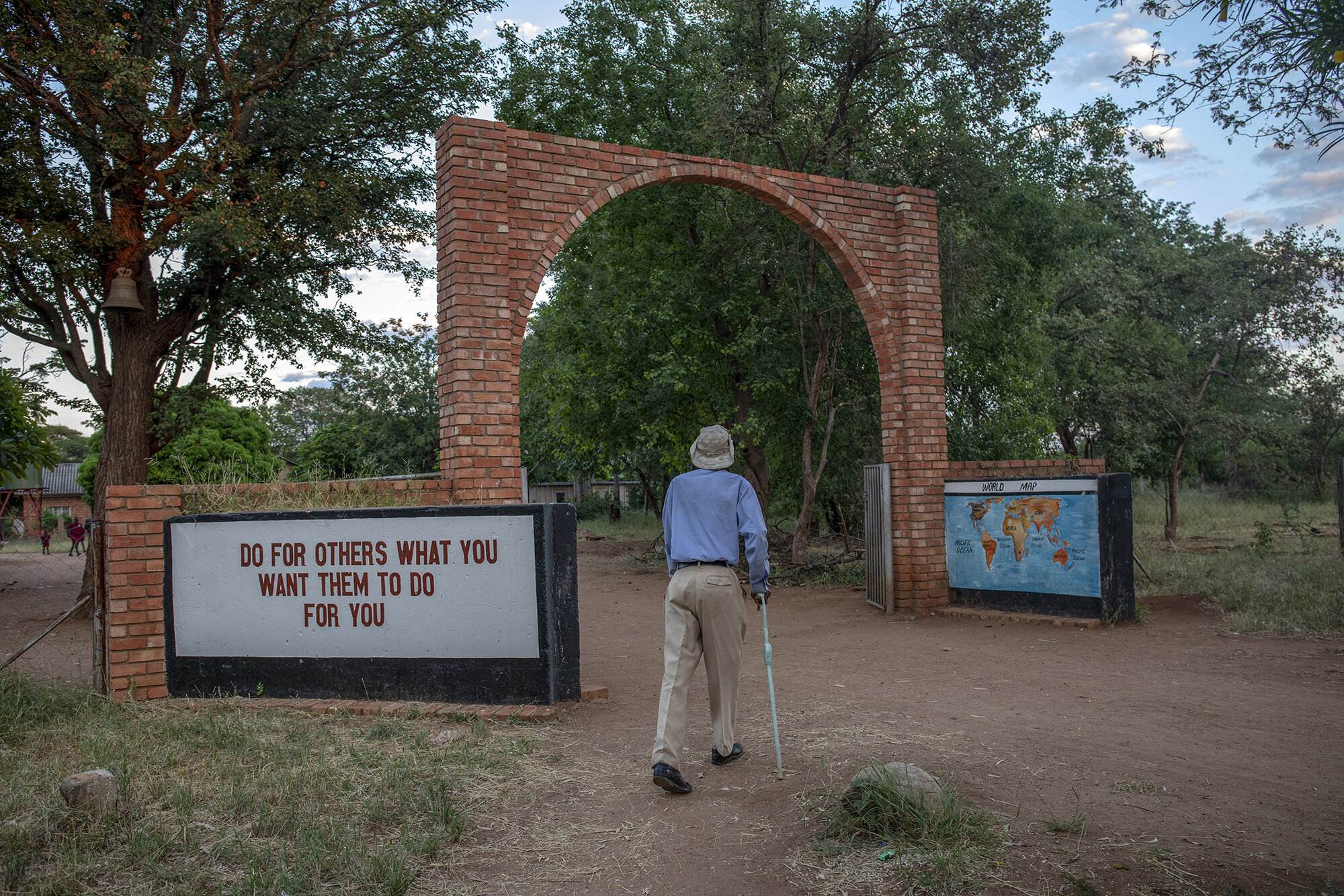  Every morning William Phiri walks to a nearby catholic church in his community in Dete, Zimbabwe to attend mass. He believes God protects us all in our daily lives.  