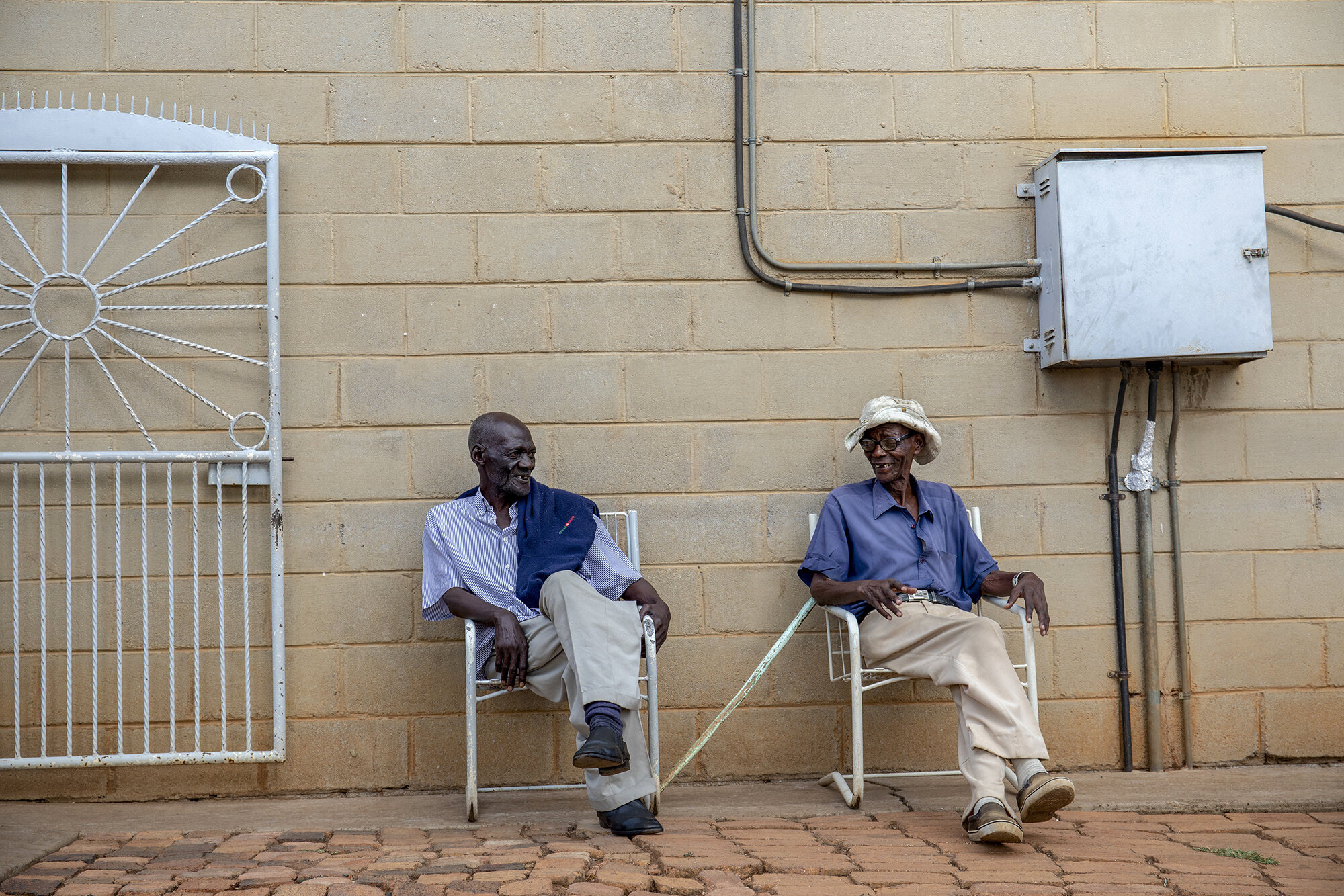  William Phiri shares a laugh with his companion at Dete Old Age Home, Dete. 
