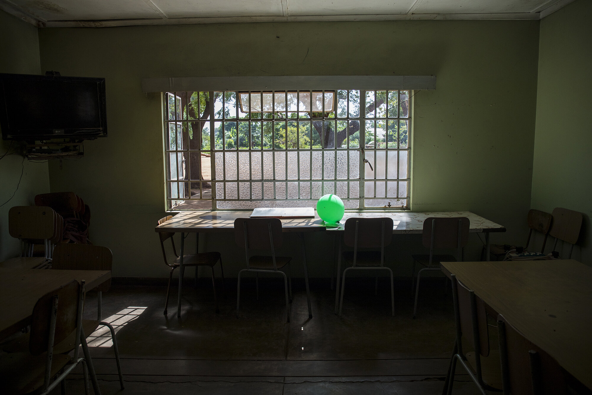  A balloon sits on a table inside the old age home cafeteria after Easter weekend.   