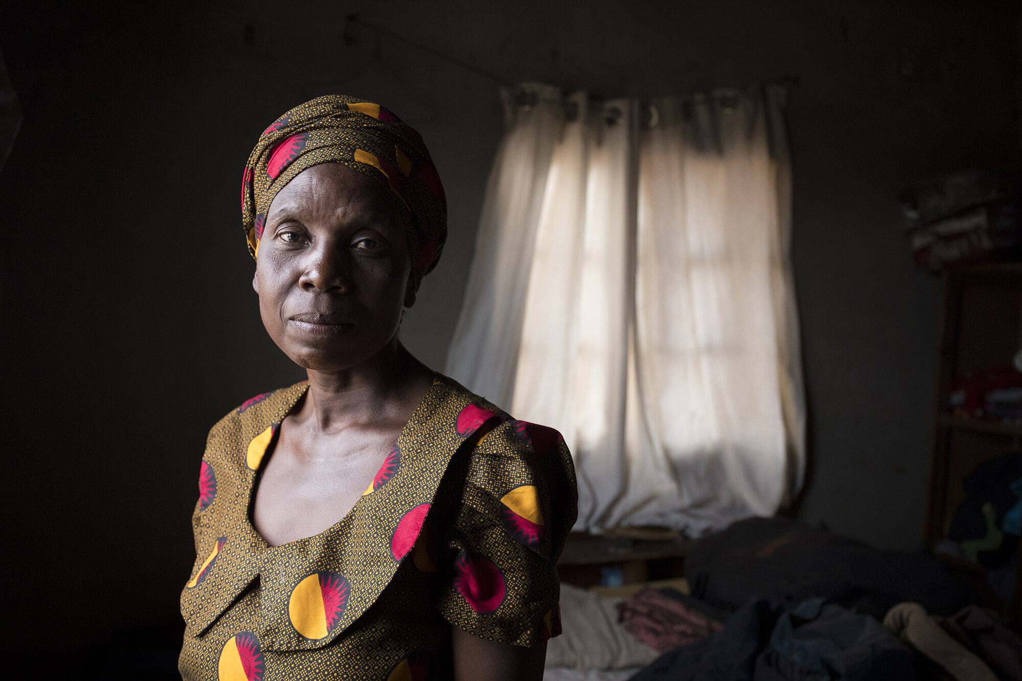  A portrait of Sifiso at her home in Matobo, in Zimbabwe’s Matabeleland South province where she lives with her husband and 6 of her 7 children. She has been farming since 1973 supporting her family.  - For Oxfam GB  