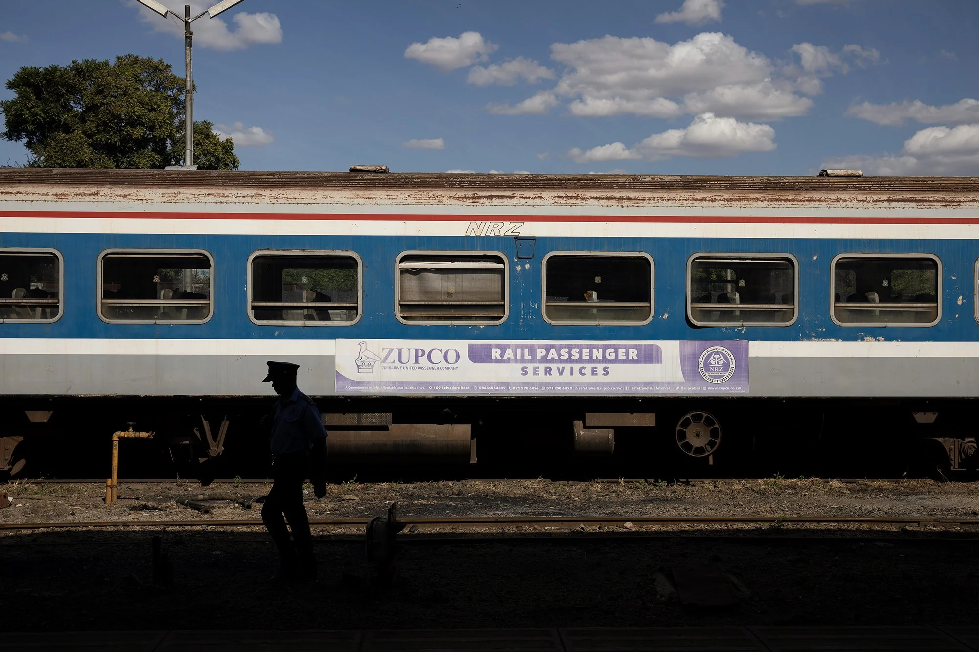 May 24, 2024 - A Notional Railways of Zimbabwe security guard walks past a disused passenger train at the parastal's station in Harare, Zimbabwe. Zimbabwe is in talks with China Railway Group Ltd. to help modernise the state-owned National Railways