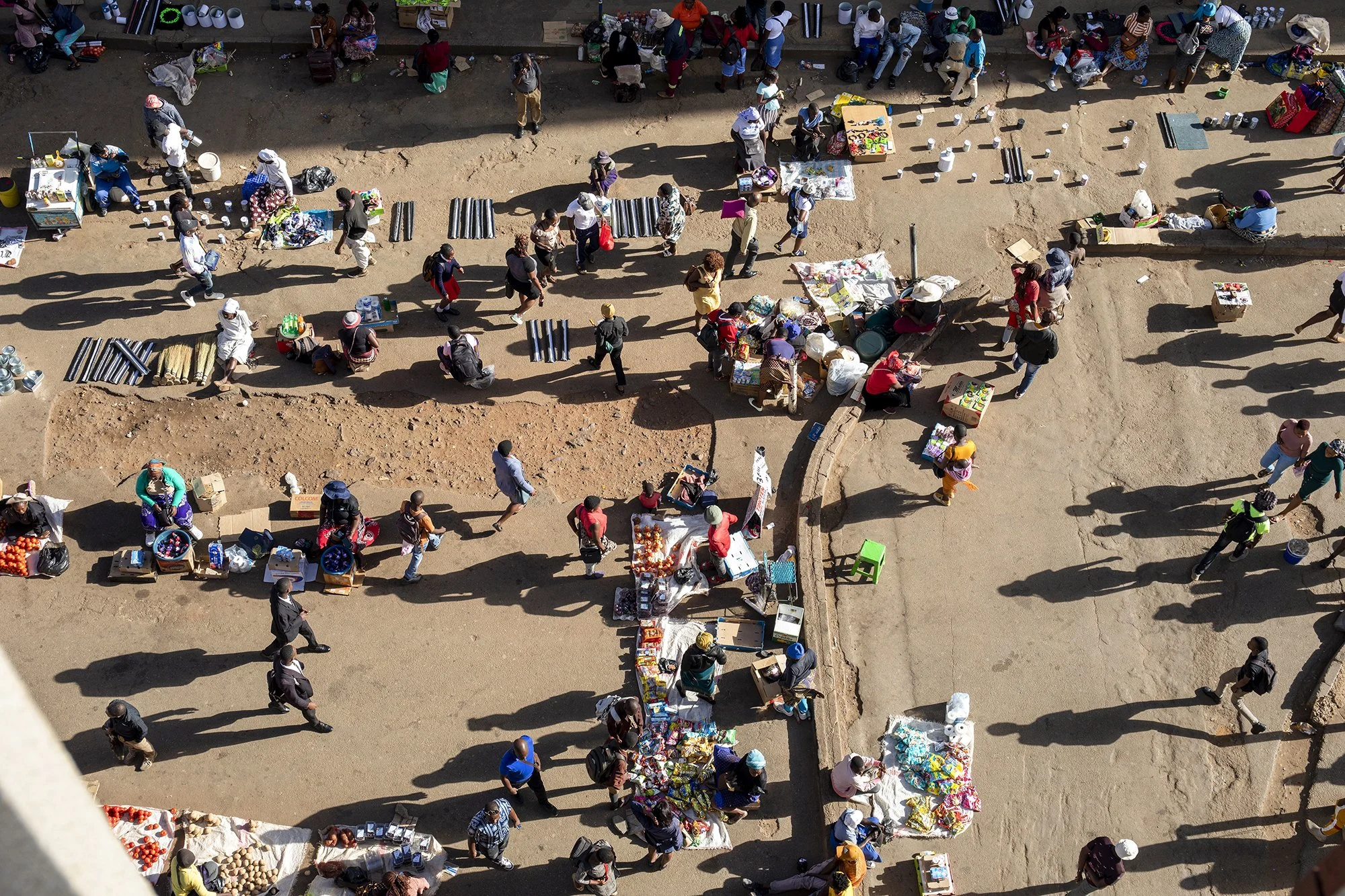 Harare, Zimbabwe - February 12, 2024: Infomal traders ply their goods outside formal shops in Harare's central business district. - For Bloomberg