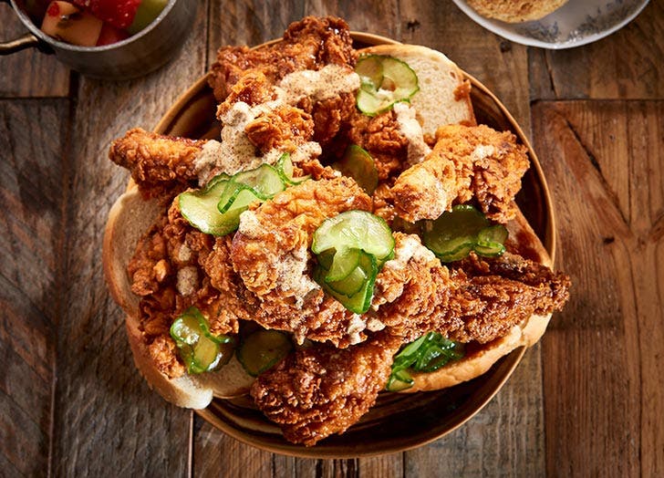 M iami New Times Best of :: Food & Drink BEST OF MIAMI® /// FOOD & DRINK /// 2017 Bird & Bone BEST FRIED CHICKEN Nashville hot chicken is the centerpiece of the menu at Bird & Bone. This is fried chicken food porn at its finest. After all, you are sinking your teeth into a golden breast or thigh, crisp on the outside, moist and juicy on the inside. What could make it even more sensual? A tingle on the lips. Richard Hales' obsession with Nashville hot chicken led him to bring the craze to Miami Beach at his Bird & Bone inside the Confidante hotel. But unlike the original iteration that turns up the fire, Hales knows it's best to tease. His chicken is brined for a day and then fried to order before being coated with a special blend of spices and peppers. Finally, he drizzles honey on the bird. The result is pure pleasure: a sweet top note gives way to a sultry warmth as your teeth penetrate the flaky crust to get to the tender flesh. Go ahead — let out a low moan. The finest porn stars always do. 4041 Collins Ave., Miami Beach, 33140 Best Of :: Food & Drink BEST OF MIAMI® /// FOOD & DRINK /// 2018 BEST HOTEL RESTAURANT Bird & Bone Chef/restaurateur Richard Hales has long been known for his Asian-fusion restaurants. After a road trip through the Southern United States left him obsessed with Nashville hot chicken, country ham, and skillet cornbread, Hales opened Bird & Bone, a Miami Beach eatery serving his unique takes on those classics, inside the Confidante hotel. His hot chicken, for instance, is made with local birds that are brined for juiciness and then dry-aged for three days (much like a Peking duck). The fried pieces are drizzled with Chinese hot mustard and honey and served on Zak the Baker bread. Enjoy your meal on a beautiful patio with the gentle sound of the nearby waves crashing on the sand for one soulful evening meal. Hours are 7 a.m. to 10 p.m. Sunday through Thursday and 7 a.m. to 11 p.m. Friday and Saturday.