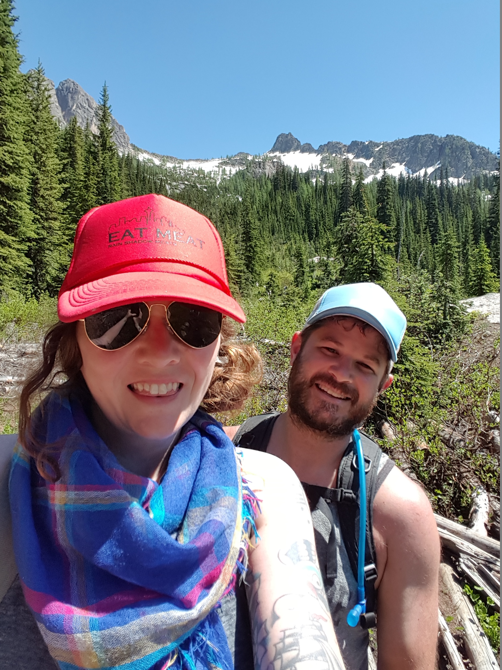 Anna and Russ on a hike to Blue Lake, working for their fried chicken dinner! Anna is representing with her "Eat Meat" hat.