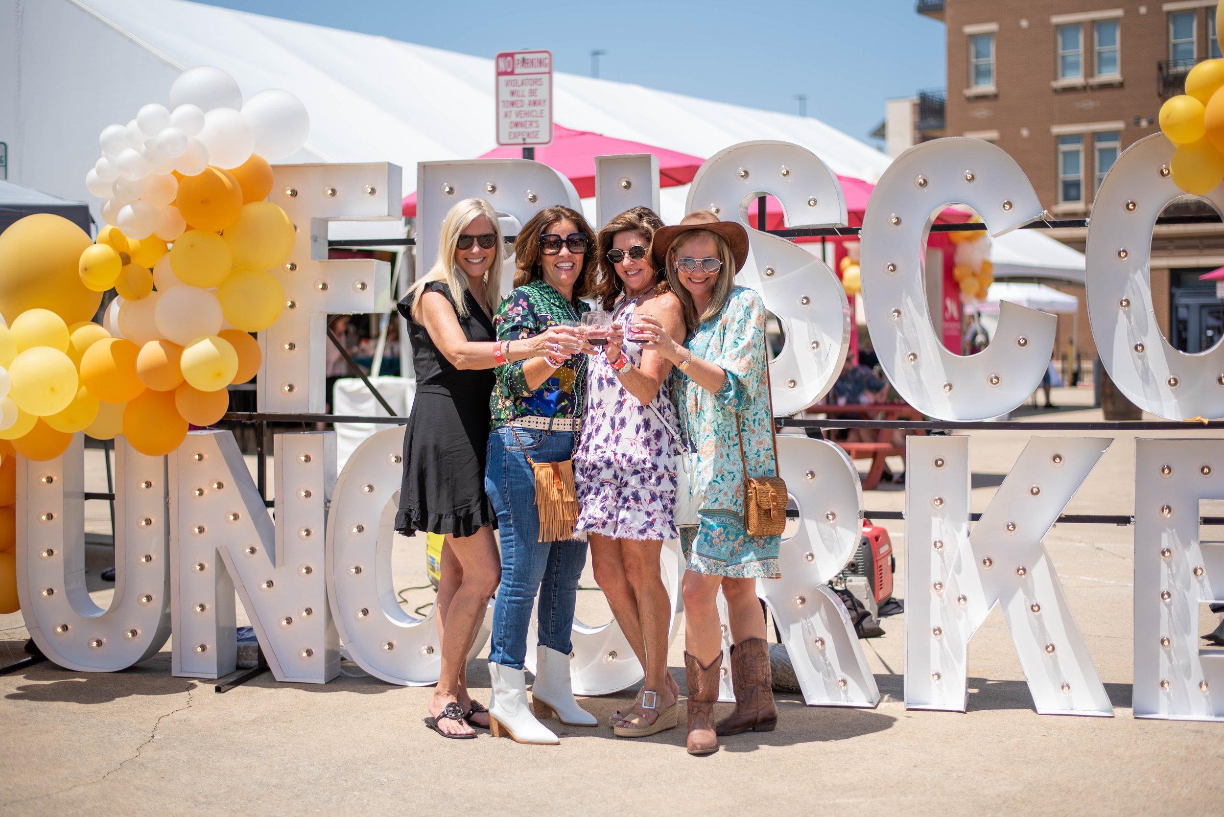 2022.04.30 Frisco Uncorked - Ladies, glasses, Uncorked sign.jpg