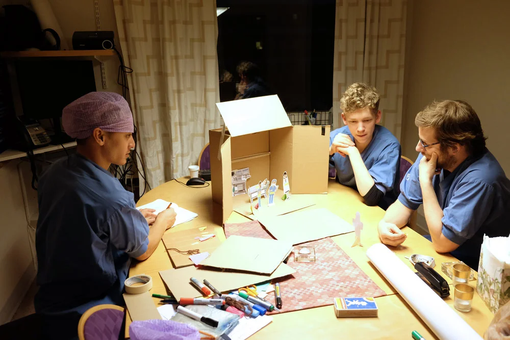 Role playing with a puppet theatre set.