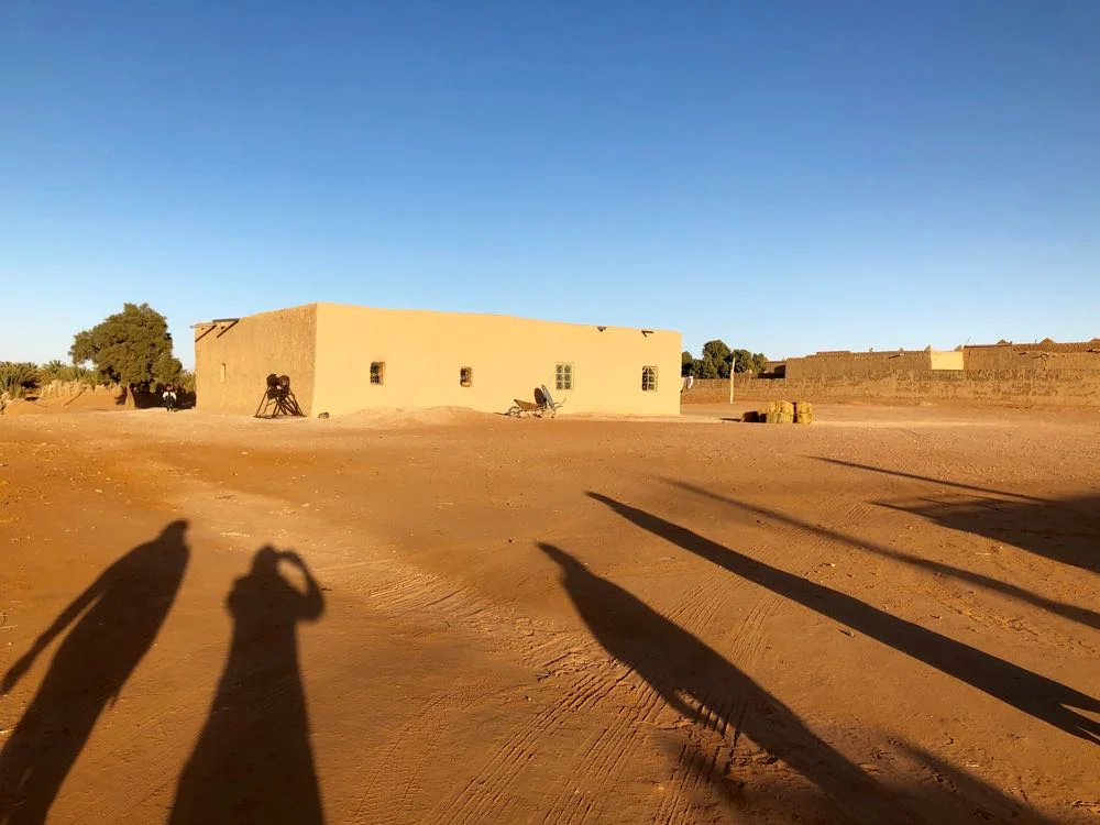 Muhammed’s home. And our long shadows - that’s me, second from left.