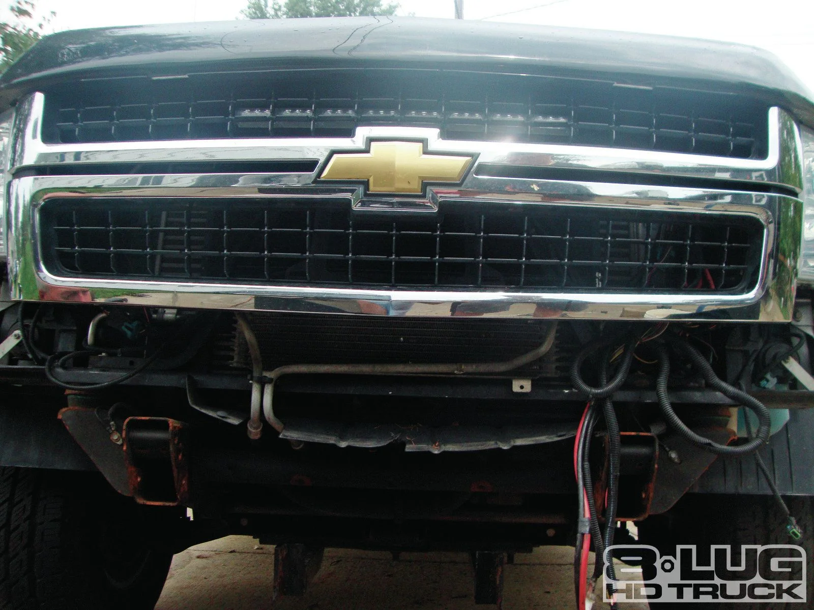 1210-8l-02+winch-time-ultimate-tow-and-work-truck-upgrades+brackets-bolted-to-backside.jpg