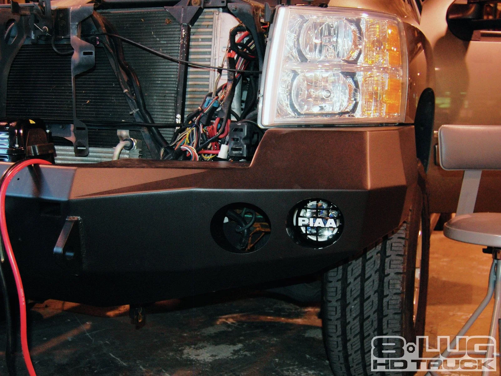 1210-8l-17+winch-time-ultimate-tow-and-work-truck-upgrades+lamp-is-fitted.jpg