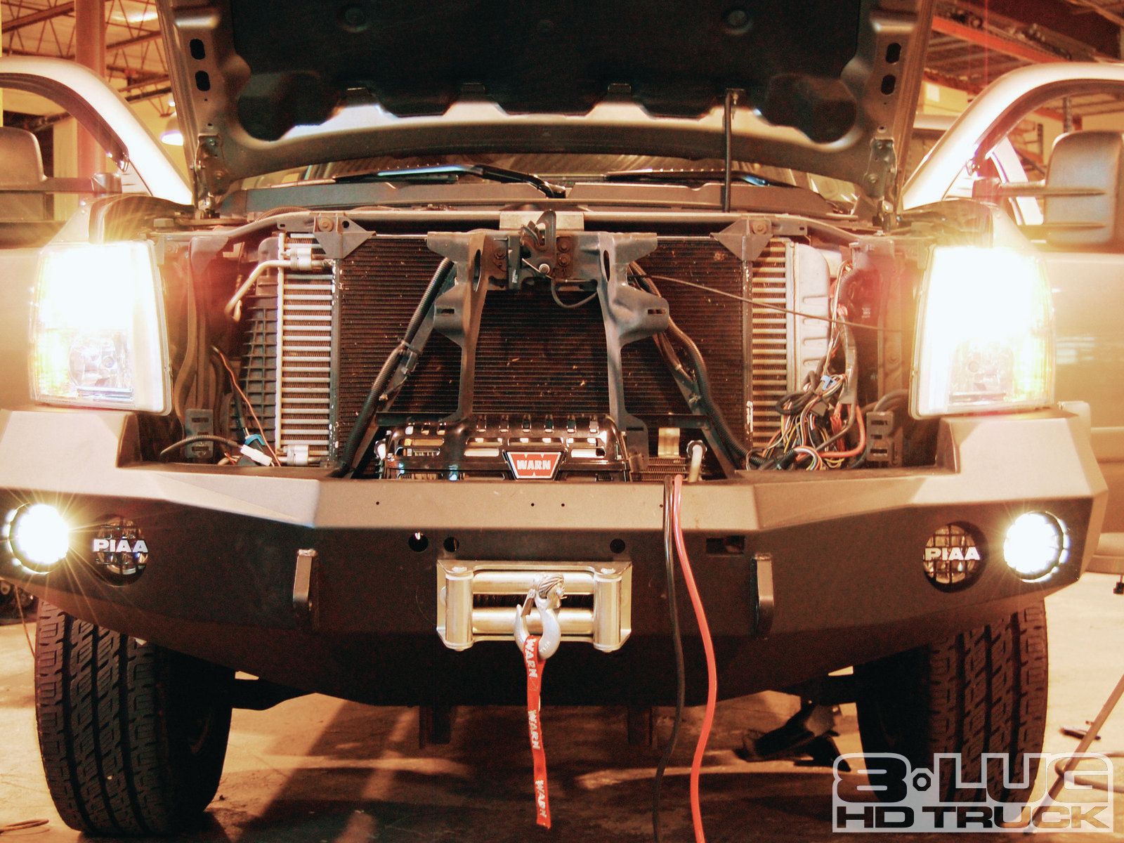 1210-8l-18+winch-time-ultimate-tow-and-work-truck-upgrades+all-four-lights-mounted.jpg
