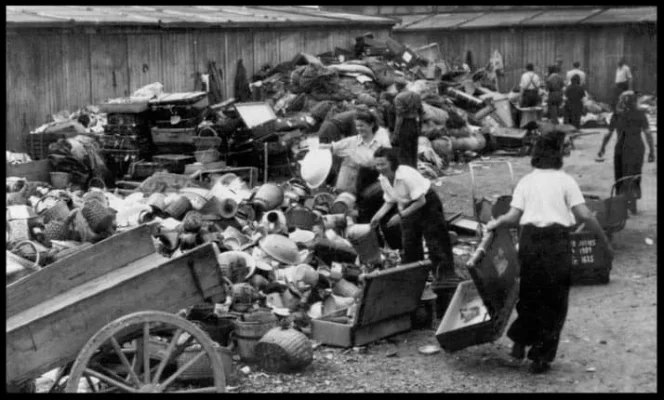 Prisoners sort their belongings before being led to the gas chambers.
