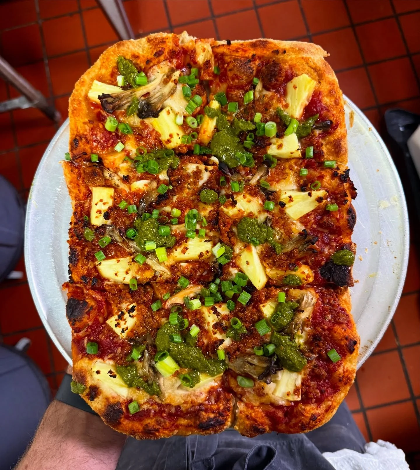 A Vulgar Display of Pineapple. 😛

Crushed tomato, mozzarella, fresh pineapple, @thebehive sausage crumble, zhoug, green onions. 

This pizza is in competition for #1 seller which is kinda nuts but we are here for it. Have you tried it yet?