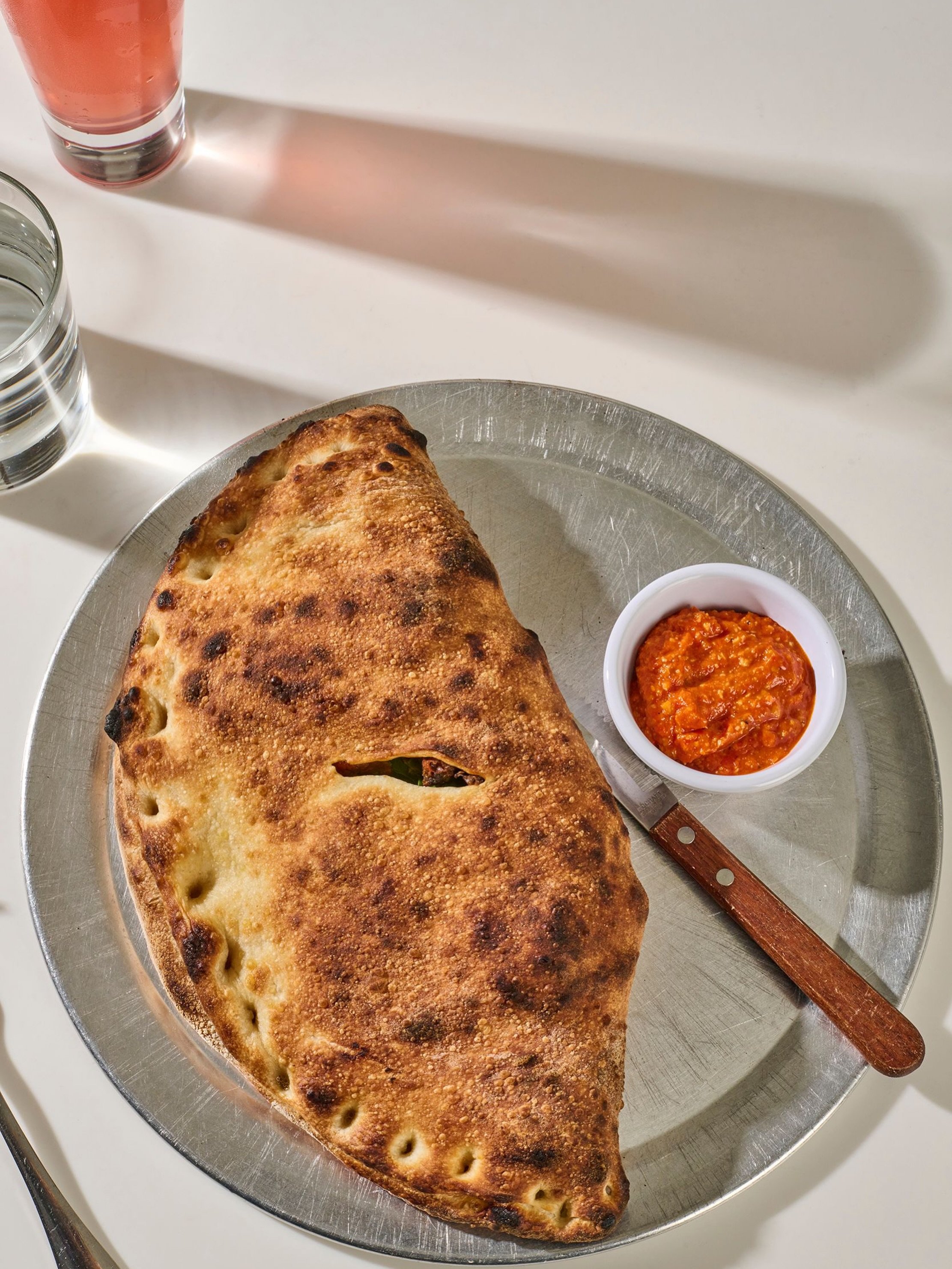 Did you know we serve a calzone on the weekends? 
brunch is served 11-3pm every Saturday + Sunday. 

Breakfast in Bread: tofu scramble, seitan sausage crumble, spinach, red onion, crushed tomato, home fries, roasted carrot cheddar. served with a side
