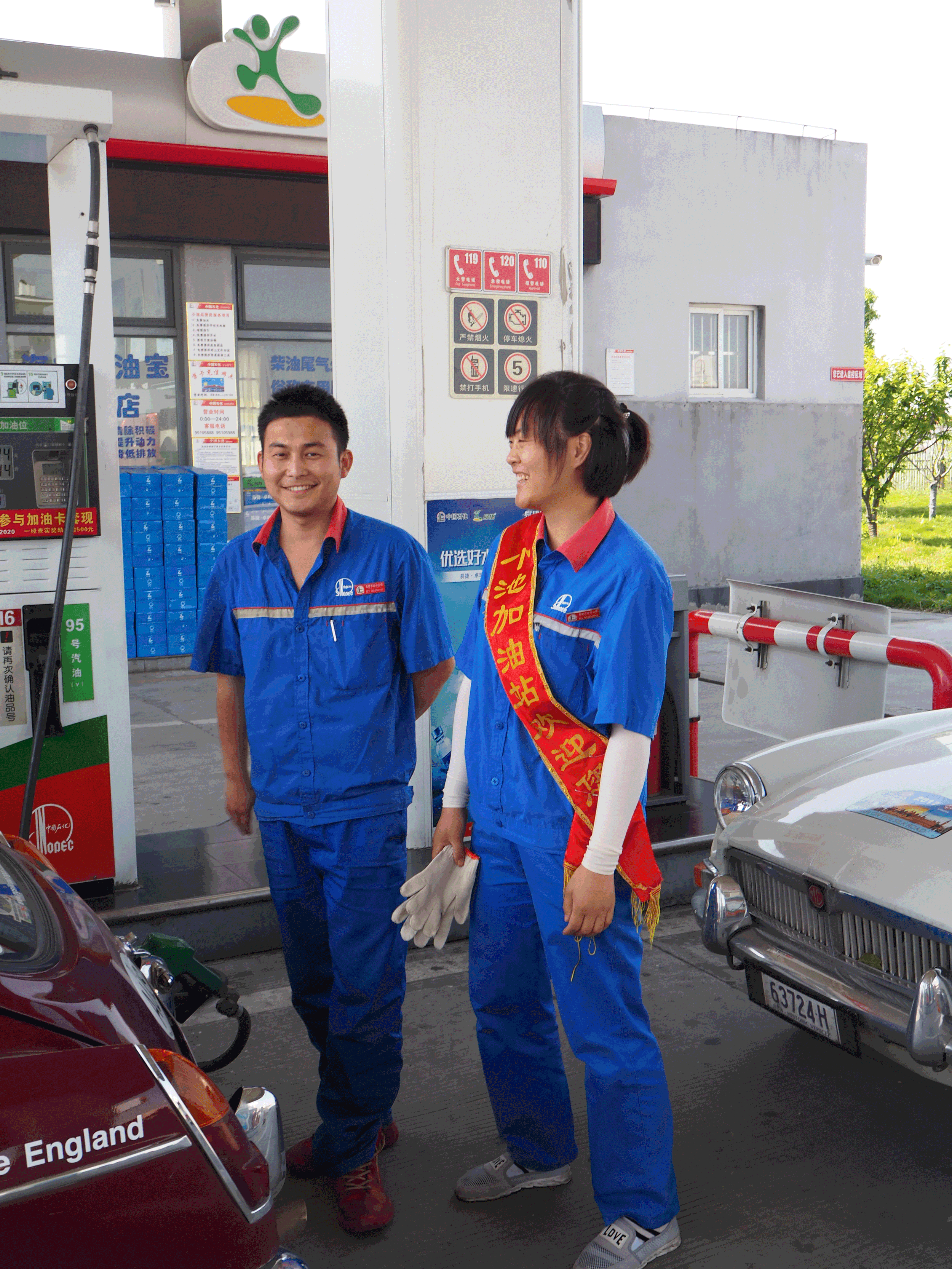It takes 2 to fill an MG with petrol in China. One to pour and one to collect the money.