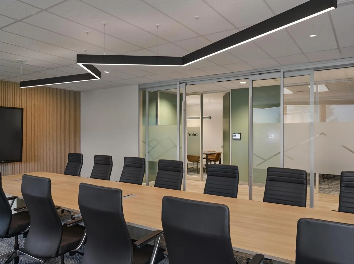 The boardroom for Just Energy sorely needed an upgrade to the dim and mis-matched lighting. We added this extended linear fixture, in a subtle lightning bolt shape, to be both functional and fun.⚡️😌💛
📷 by @stephanibuchmanphoto 
➡️ for the before