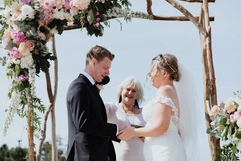 Nathan and Gemma exchanging vows. Photography by All My Wednesdays.
