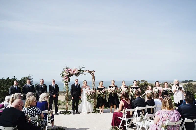 The bridal party looking stunning with that beautiful backdrop.