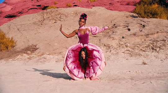 Just two women dressed in pink enjoying the dessert. Nothing to see here. 