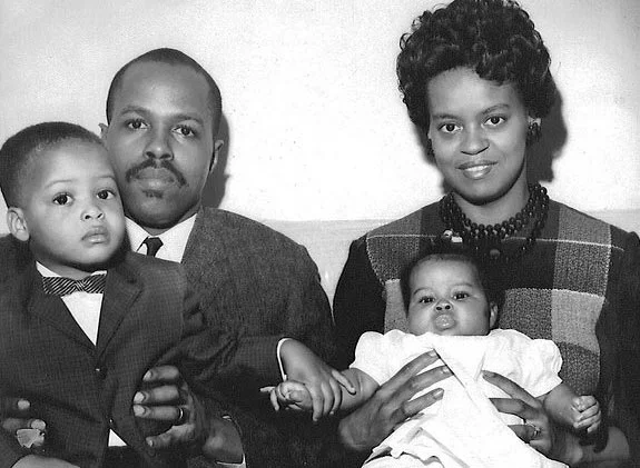 The Square. Pictured here - Michelle’s parents, Fraser Robinson III and Marian Robinson, her brother, Craig Robinson, and baby Michelle.