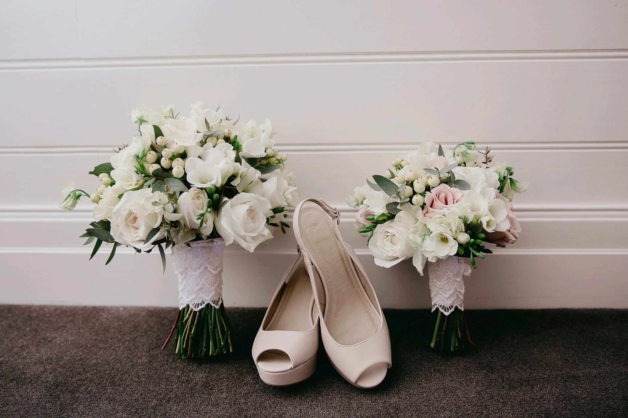 Brides flowers and shoes in bedroom .jpg