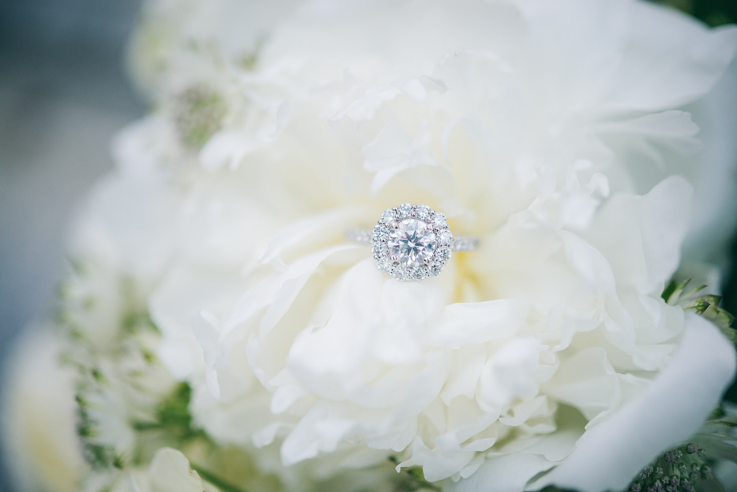 NH Wedding Photographer: engagement ring in bouquet