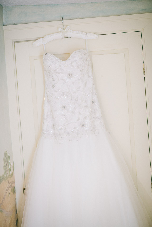 NH Wedding Photographer: bride's dress on door
