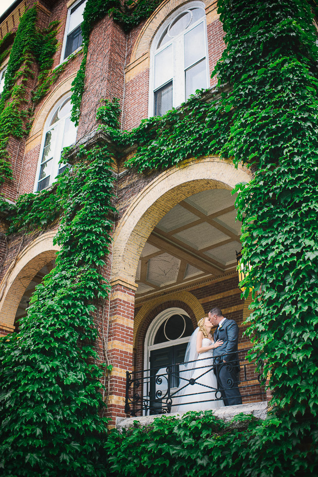 NH Wedding Photographer: couple on porch with ivy