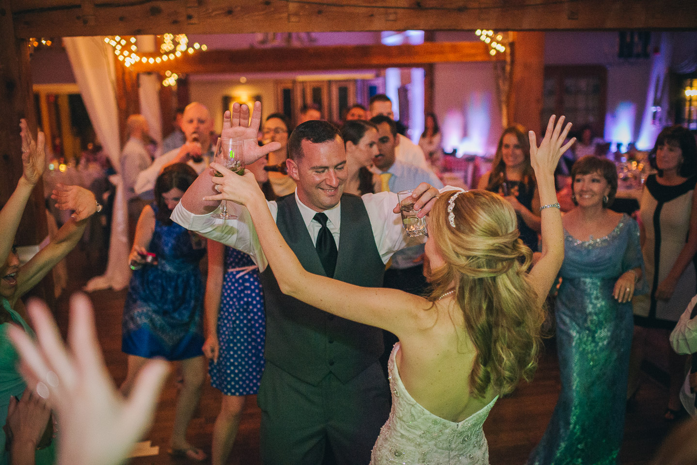 NH Wedding Photographer: guests dancing with bride and groom
