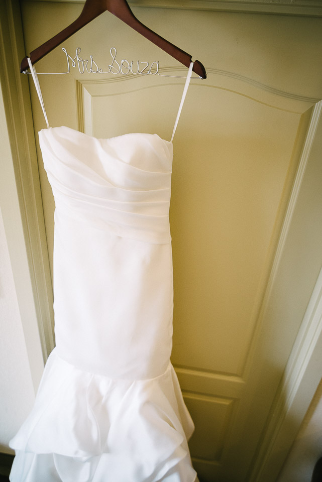NH Wedding Photographer: brides dress on door