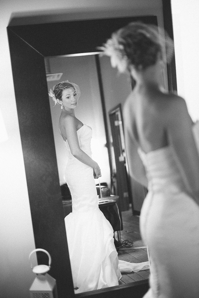 NH Wedding Photographer: bride looking into mirror