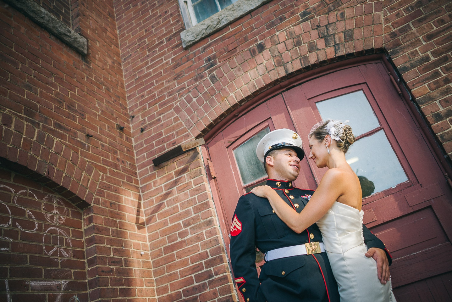 NH Wedding Photographer: bride and groom outside mill building