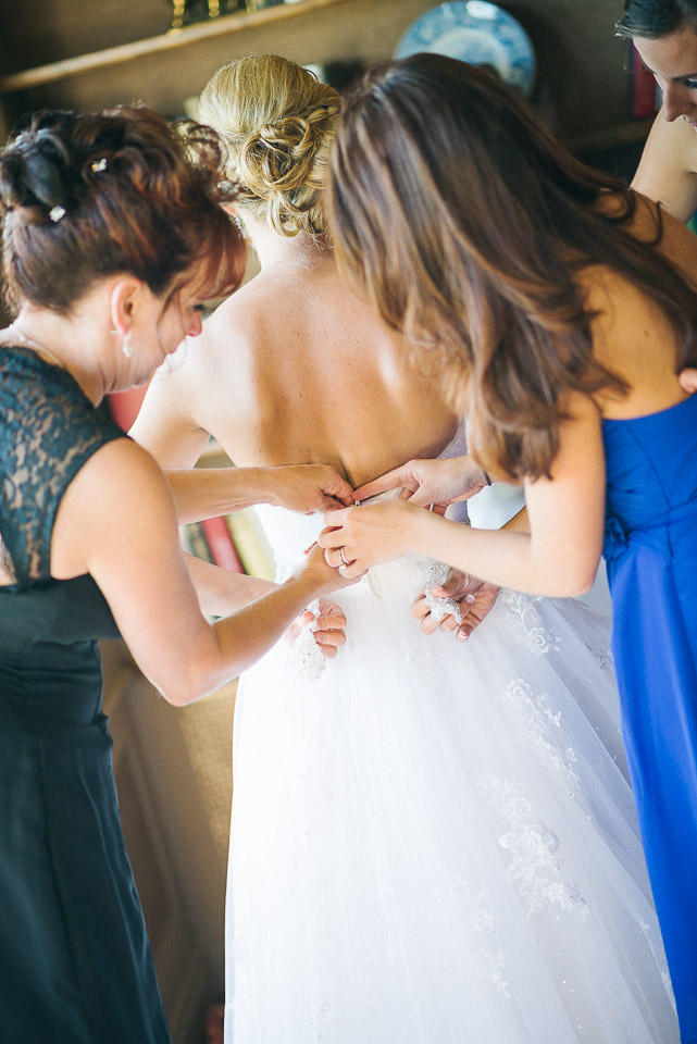 NH Wedding Photographer: bride getting dressed