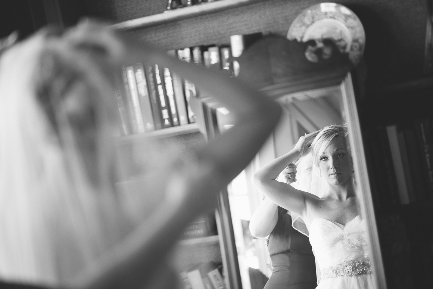 NH Wedding Photographer: bride looking into mirror