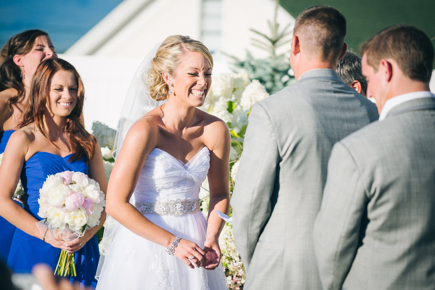 NH Wedding Photographer: bride laughing at ceremony