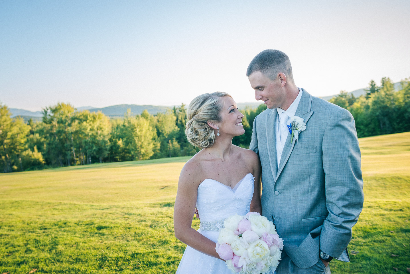 NH Wedding Photographer: bride and groom in the landscape