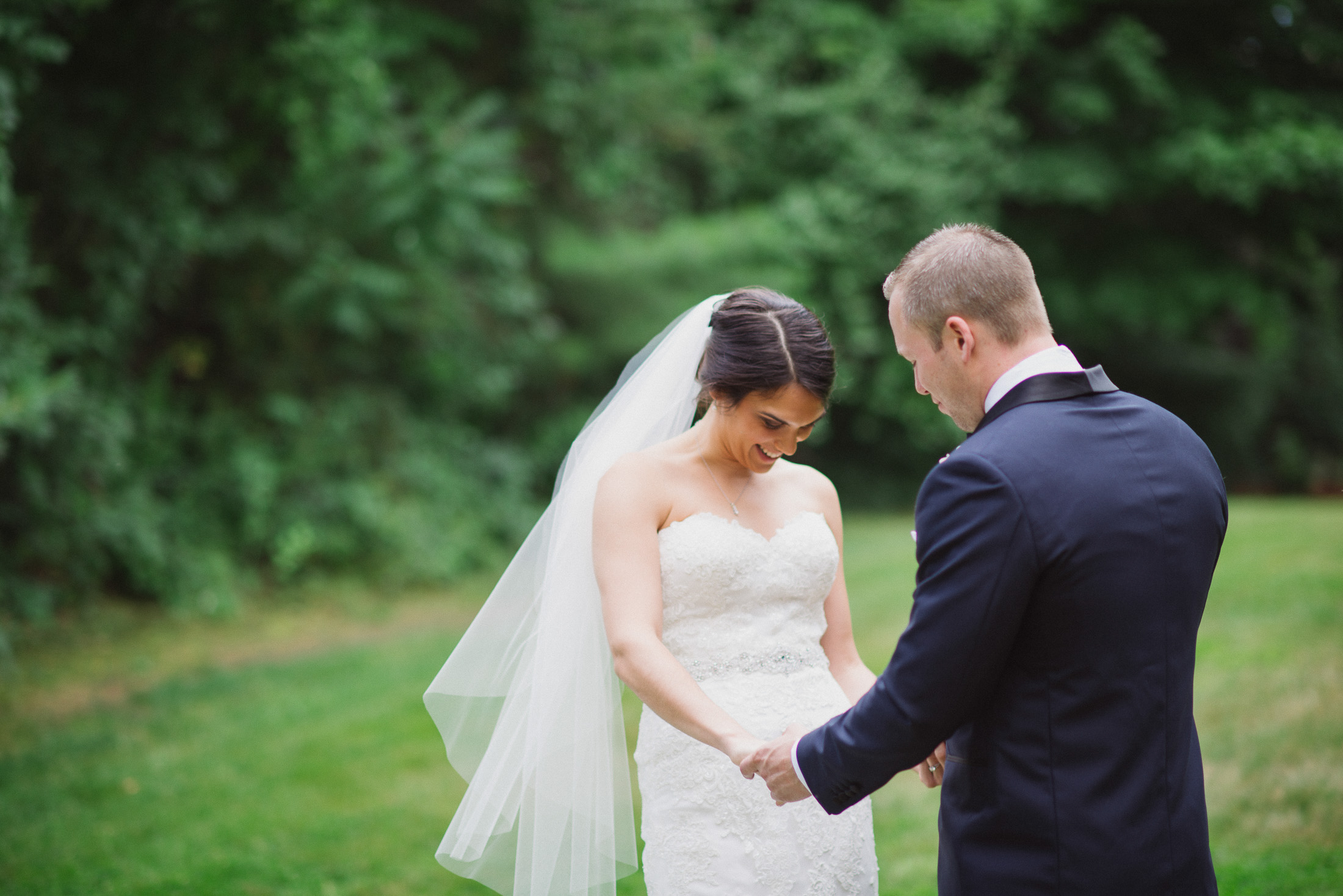 NH Wedding Photographer: couple holding hands during first look