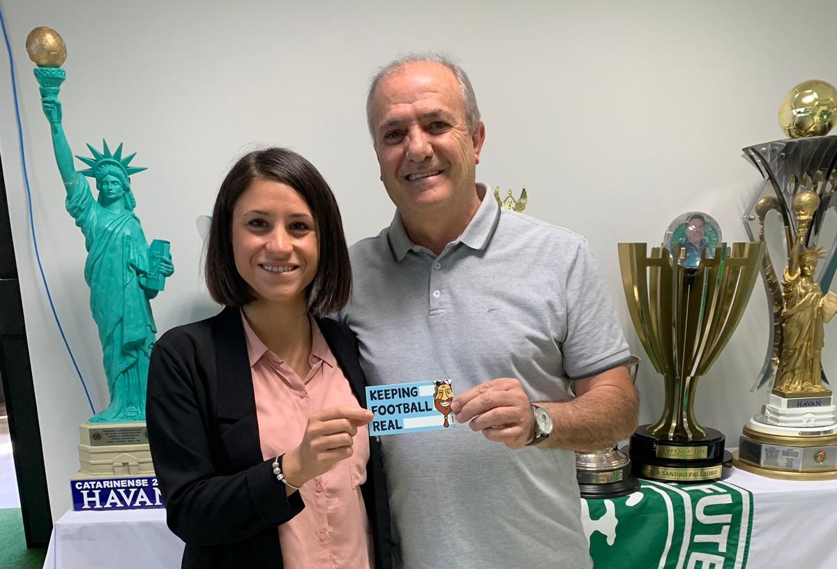 Judith with the club President Ivan Tozzo, both holding #BabaStickers (Photo: Yotam Tzuker)