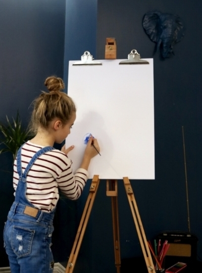 Getting creative on the easel in the apartment.