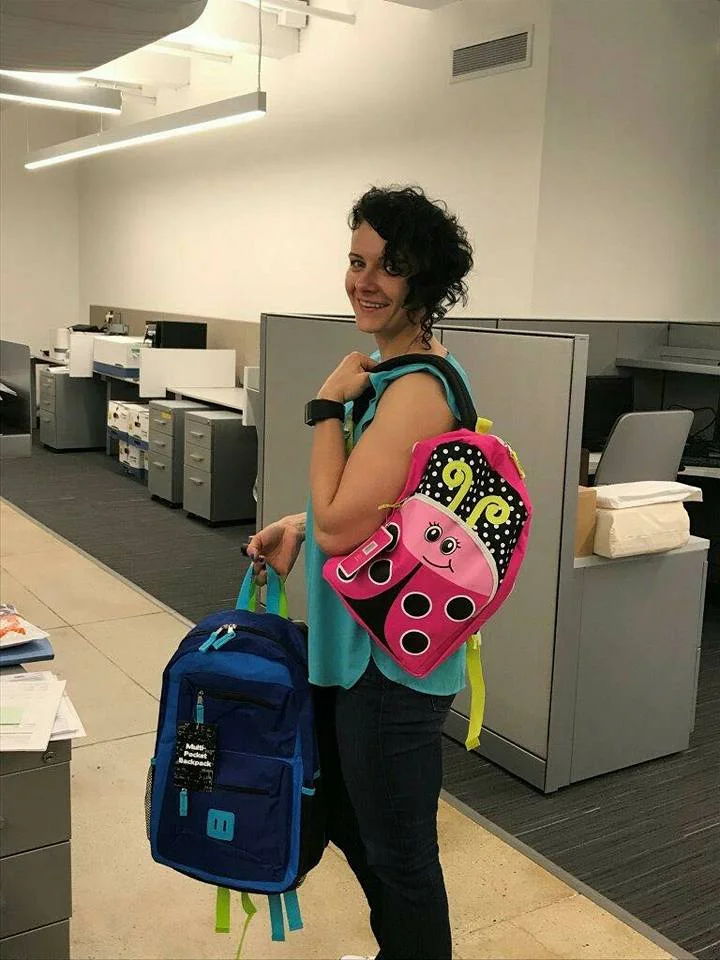 Patrycja Leszczynski tries a backpack on for size.