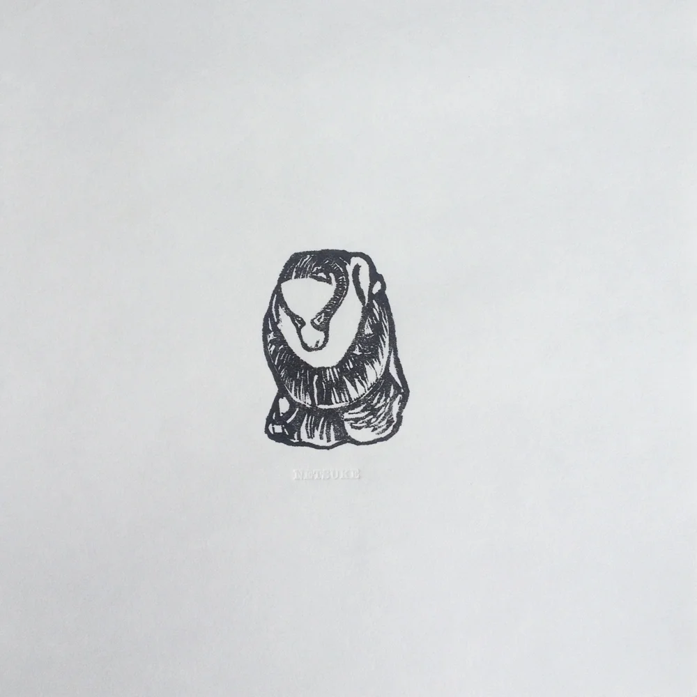 Netsuke - Fox or Tanuki Wrapped in Monk’s Robes