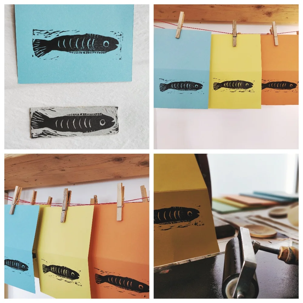 Hanging the fish prints up to dry.