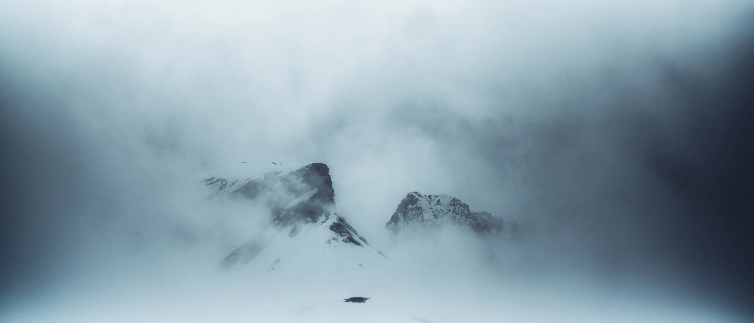   [ Vordere Hasenfluh, 2534m, seen just for 5 seconds during early spring weather breakdown, Austria ]  