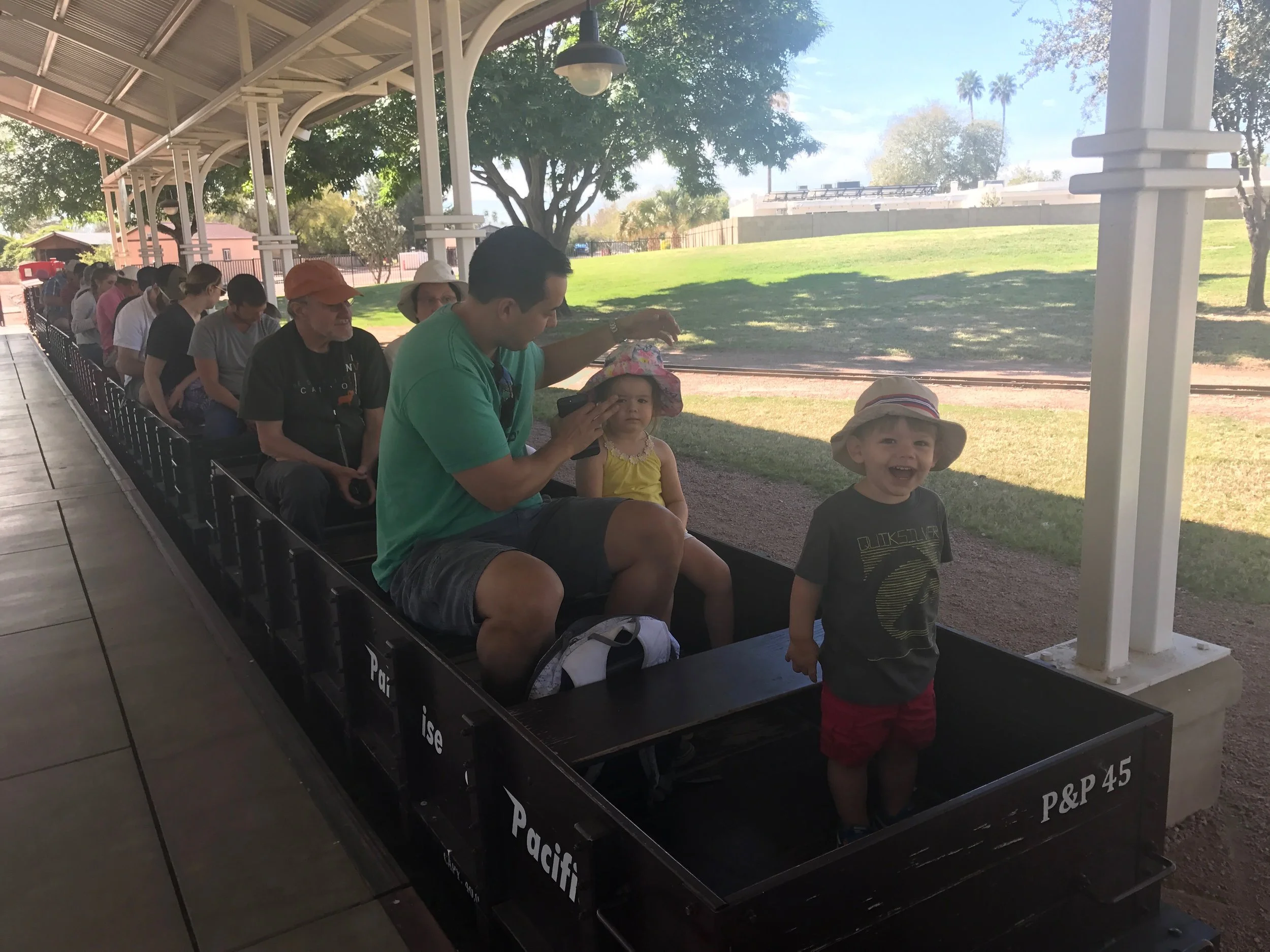 Henry couldn't contain his enthusiasm as we all took our seats to ride the rails at the Mccormick-Stallman Railroad Park.
