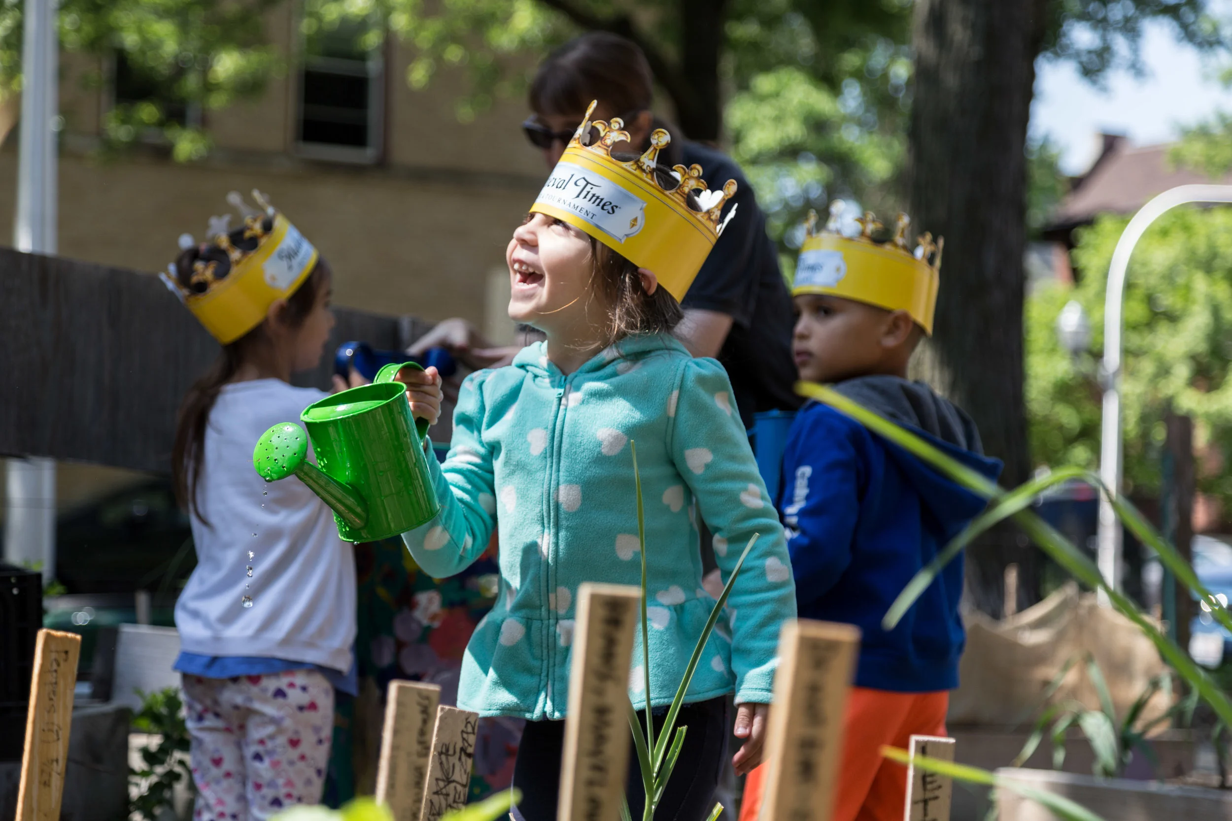 Preschoolers from Christopher House water plants and vegetables at the Altgeld Sawyer Corner Farm.